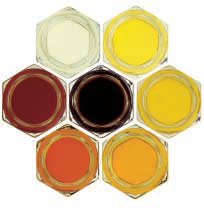 Honey Colors; clockwise from the upper left - water white, extra white, white, extra light amber, light amber, amber; center is dark amber